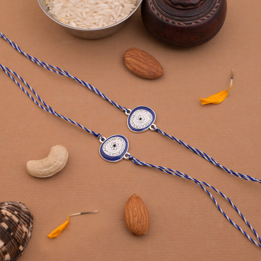 Silver Oval Evil Eye Rakhi Blue Thread Pack of 2