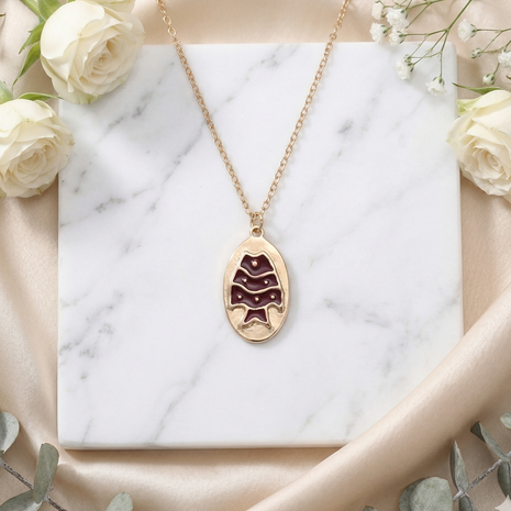 Antique Gold-Tone Oval Medallion Necklace with Maroon Enamel Fish Motif Pendant