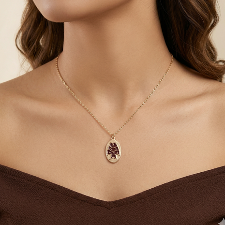 Antique Gold-Tone Oval Medallion Necklace with Maroon Enamel Fish Motif Pendant