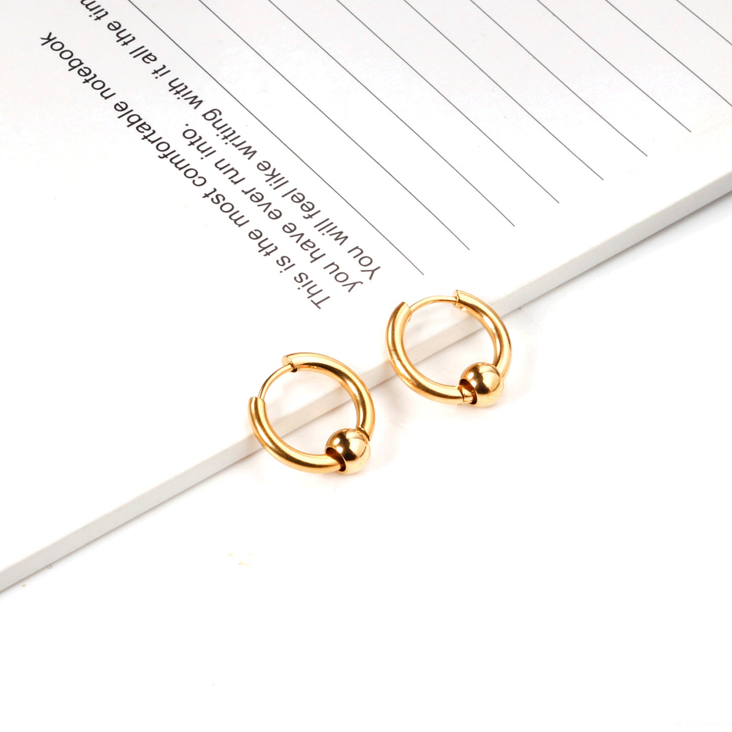 Huggie Earrings With Floating Bead