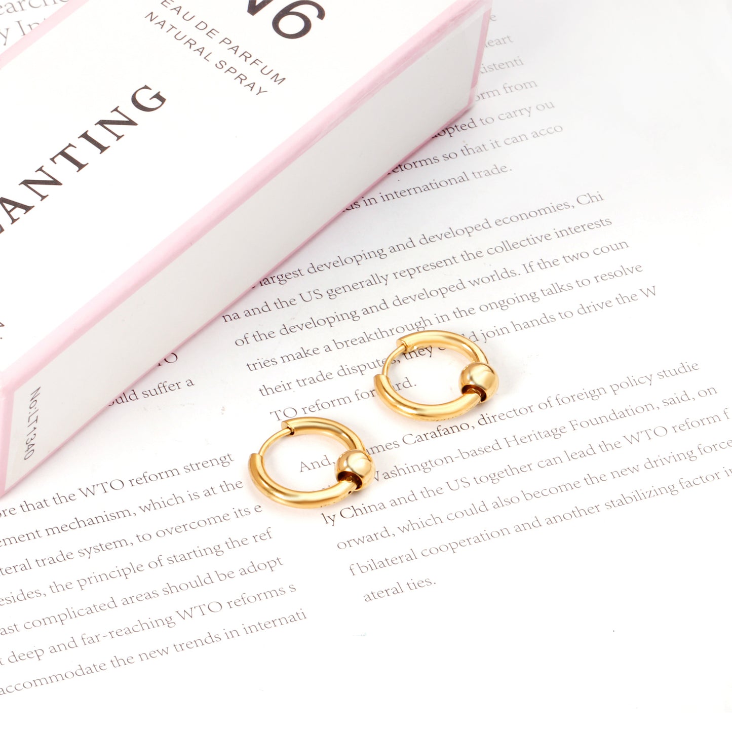 Huggie Earrings With Floating Bead