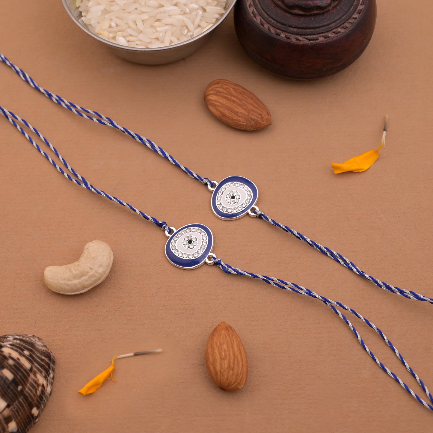Silver Oval Evil Eye Rakhi Blue Thread Pack of 2