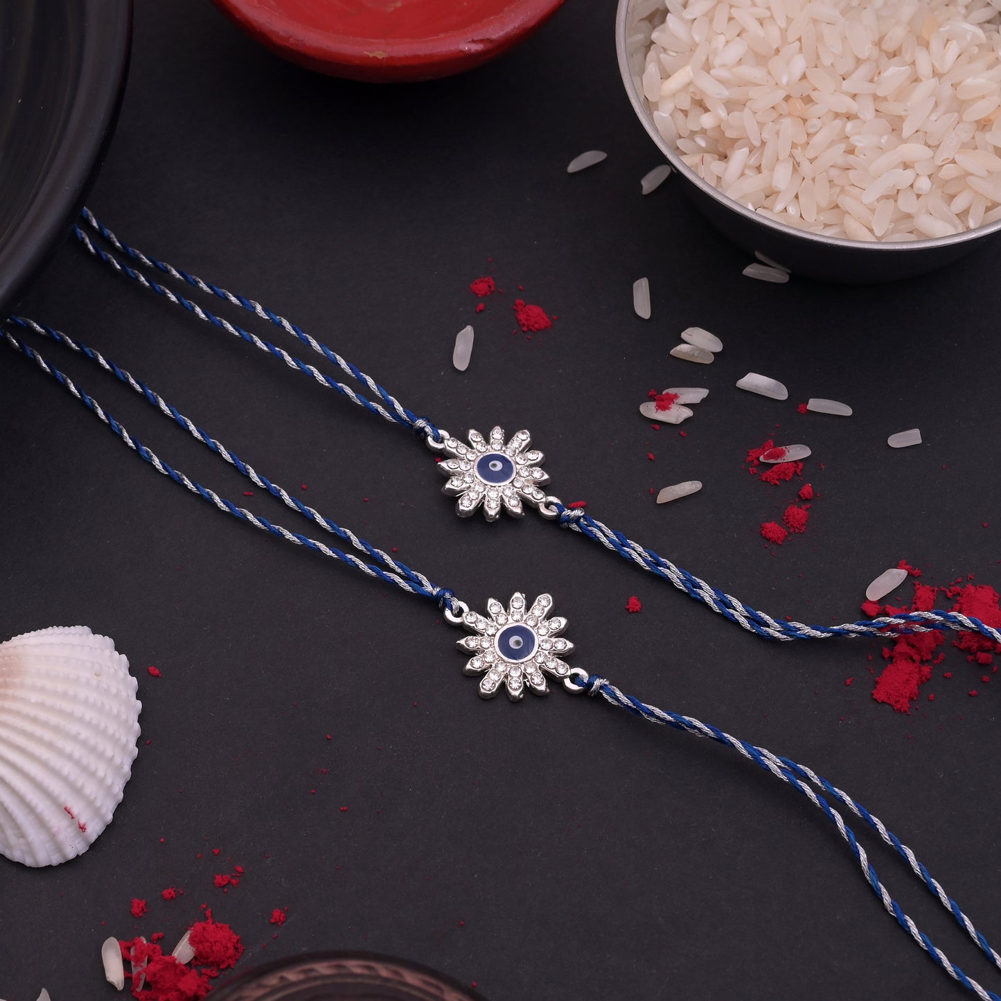 Silver Flower Evil Eye Rakhi Blue Thread