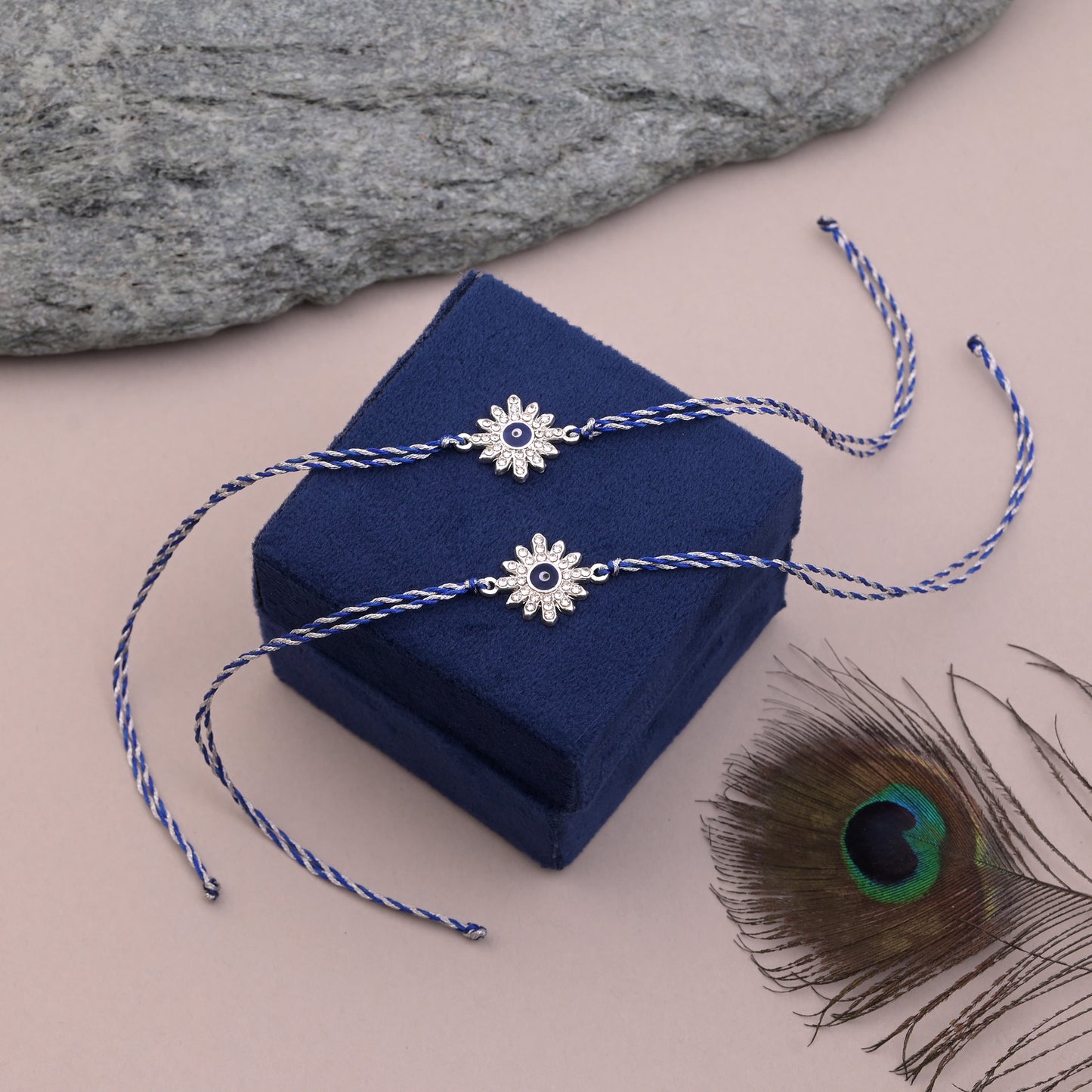 Silver Flower Evil Eye Rakhi Blue Thread